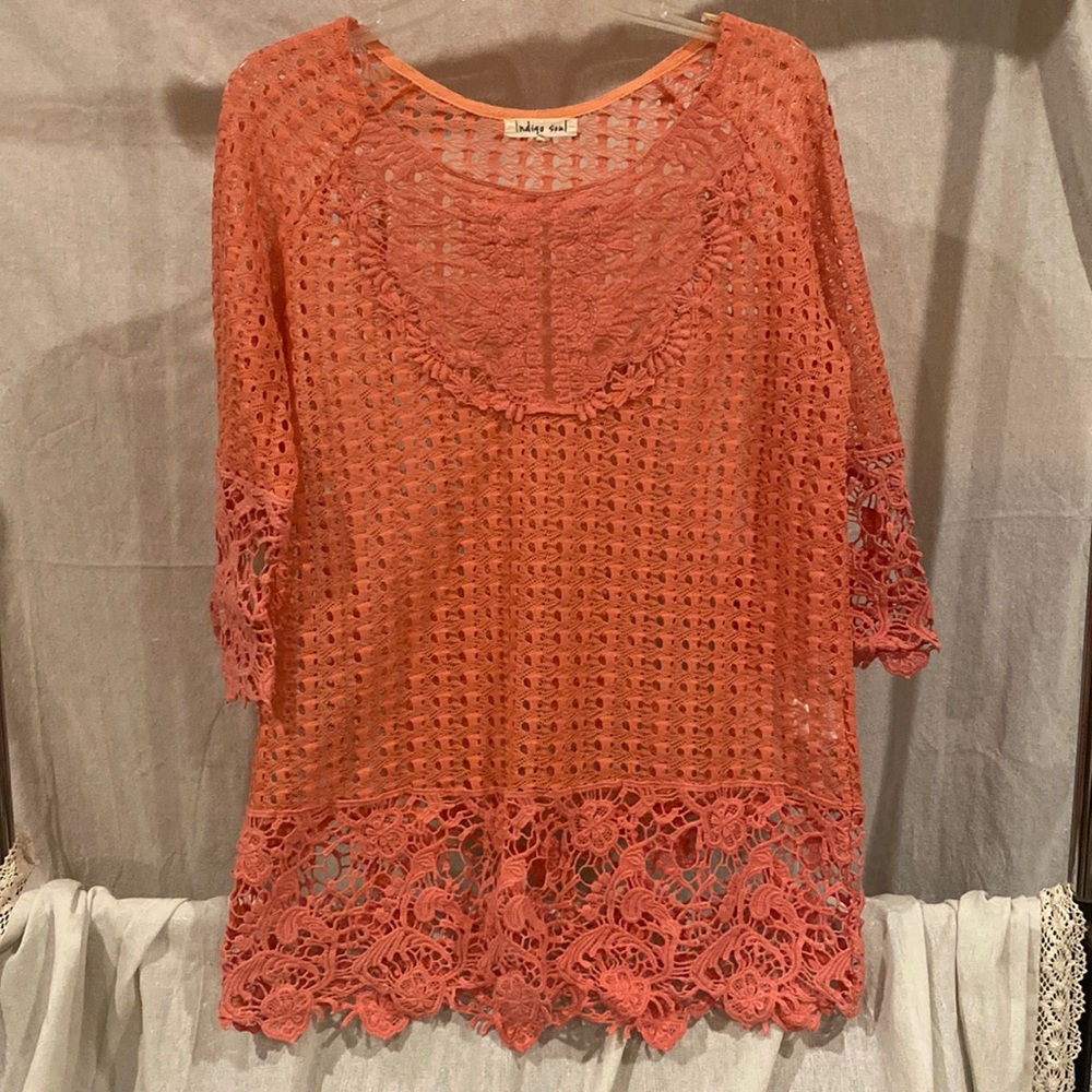 Coral colored oversized lace see through top